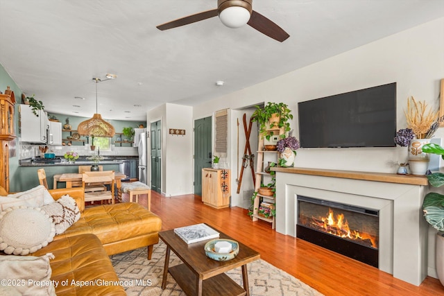 106 Lakeside Ct, Basalt, CO 81621 - living room with a ceiling fan, wood finished floors, and a glass covered fireplace