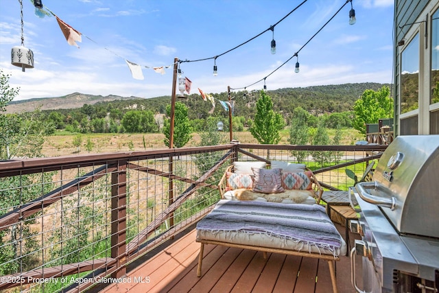 106 Lakeside Ct, Basalt, CO 81621 - deck with a view of trees, area for grilling, a mountain view, and outdoor lounge area