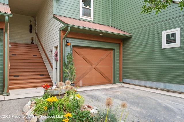 106 Lakeside Ct, Basalt, CO 81621 - entrance to property featuring a metal roof, driveway, and a garage