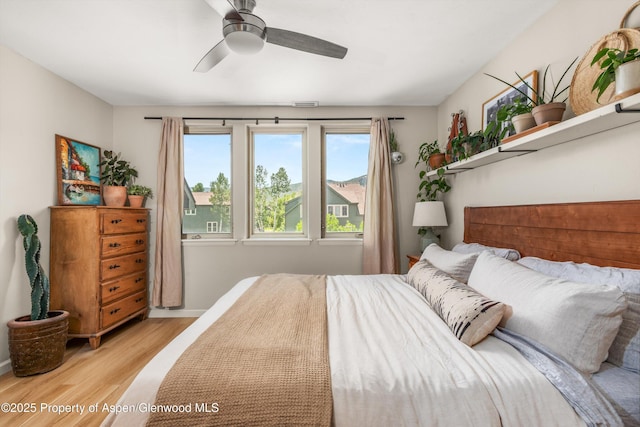 106 Lakeside Ct, Basalt, CO 81621 - bedroom with light wood finished floors and ceiling fan