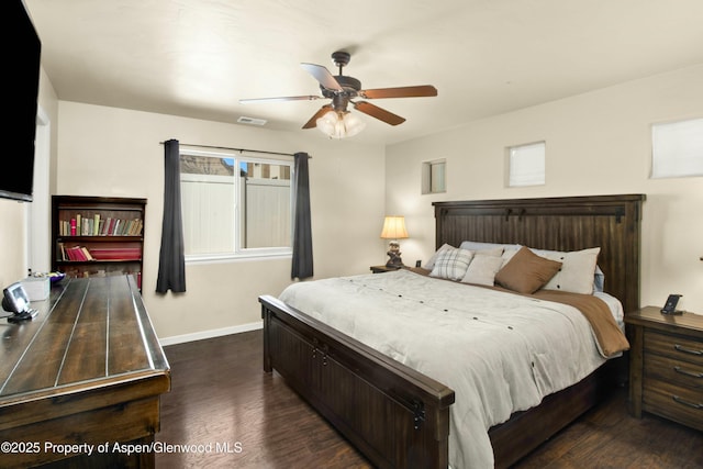 120 Harris Ln, Parachute, CO 81635 - bedroom with dark wood finished floors, visible vents, a ceiling fan, and baseboards