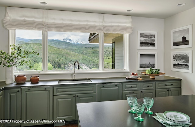 kitchen with a mountain view and sink