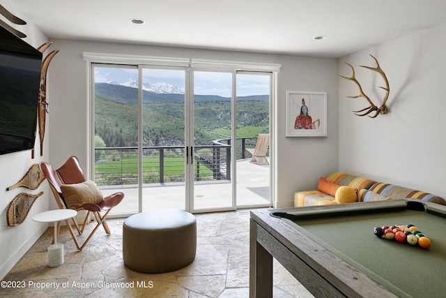 living room with a mountain view and billiards