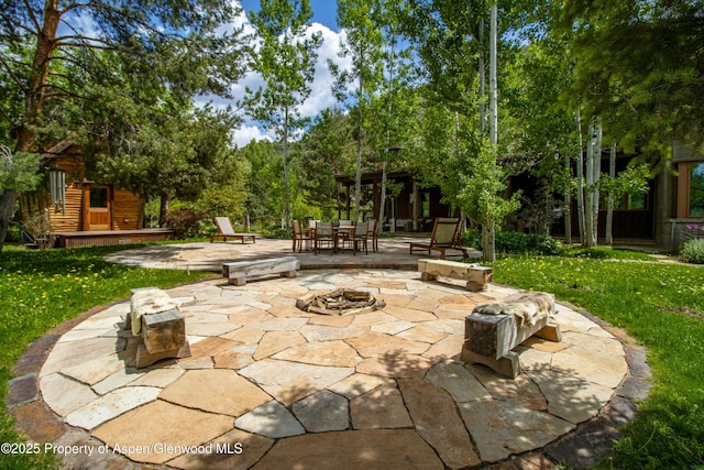 2701 County Rd 100, Carbondale, CO 81623 - view of patio with outdoor dining area and a fire pit