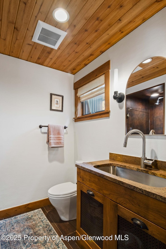 2701 County Rd 100, Carbondale, CO 81623 - bathroom featuring vanity, toilet, wood ceiling, a shower, and wood finished floors
