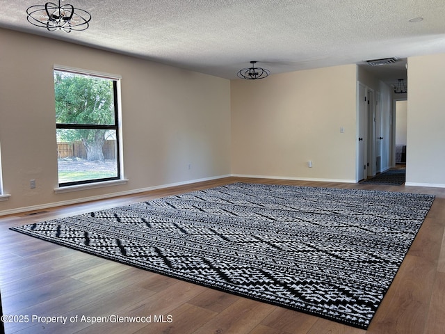 560 Willowwood Ln, Delta, CO 81416 - empty room with wood finished floors and a textured ceiling