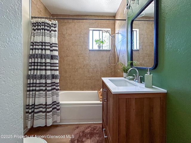 560 Willowwood Ln, Delta, CO 81416 - bathroom featuring a textured wall, vanity, and shower / bath combination with curtain