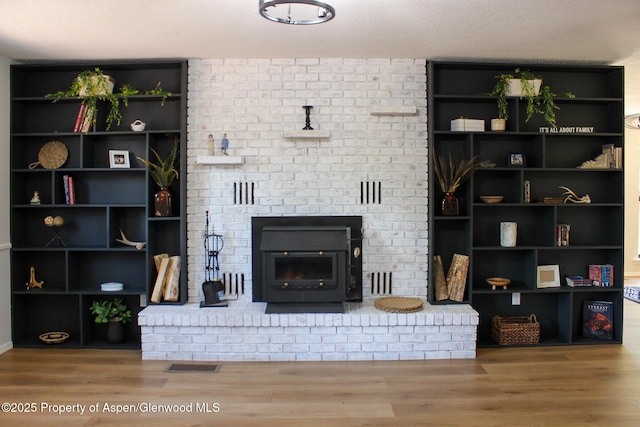 560 Willowwood Ln, Delta, CO 81416 - living room with wood finished floors and a brick fireplace