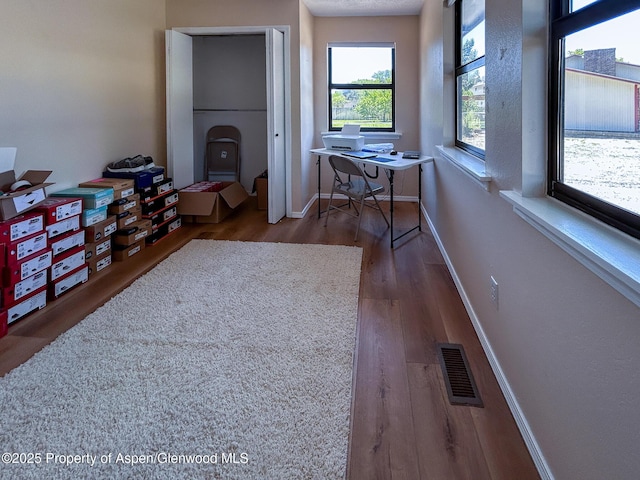 560 Willowwood Ln, Delta, CO 81416 - hall with wood finished floors and a desk