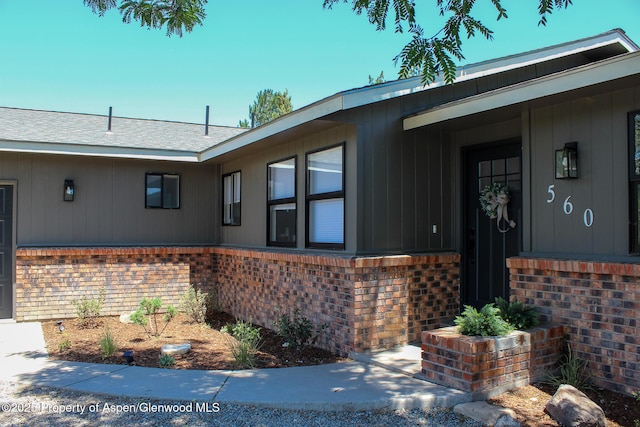 560 Willowwood Ln, Delta, CO 81416 - property entrance featuring brick siding