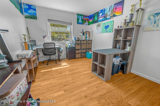 office area featuring wood finished floors and baseboards