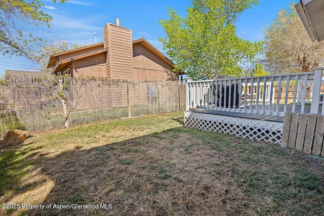 view of yard with a wooden deck