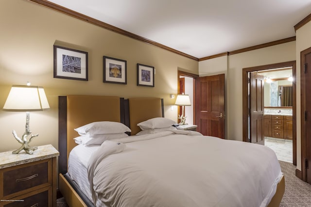 carpeted bedroom with ensuite bath and ornamental molding