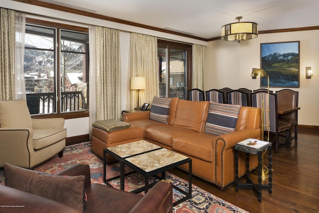 living room featuring dark hardwood / wood-style flooring and crown molding