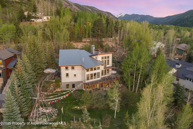 515 Park Cir, Aspen, CO 81611 - aerial view at dusk of a mountain view and a wooded view