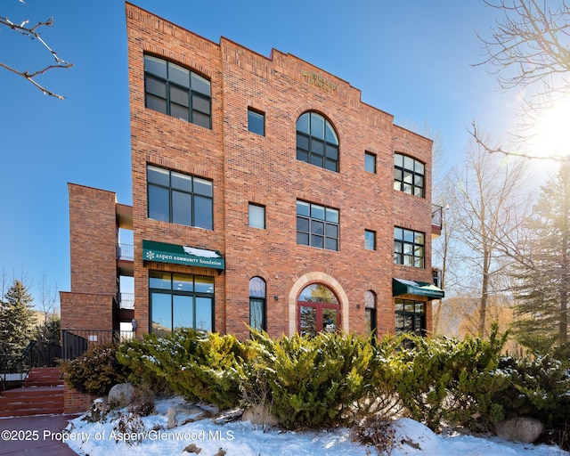 view of snow covered property