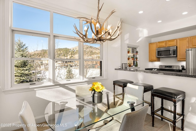 dining space featuring a notable chandelier