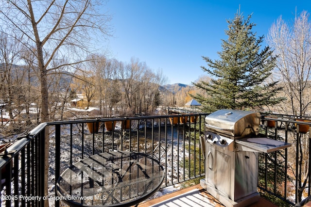 balcony featuring a grill and a mountain view