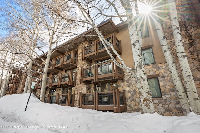 131 E Durant Ave Unit 104, Aspen, CO 81611 - snow covered property featuring a view of apartment building / complex