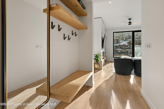 mudroom with ceiling fan and light hardwood / wood-style flooring