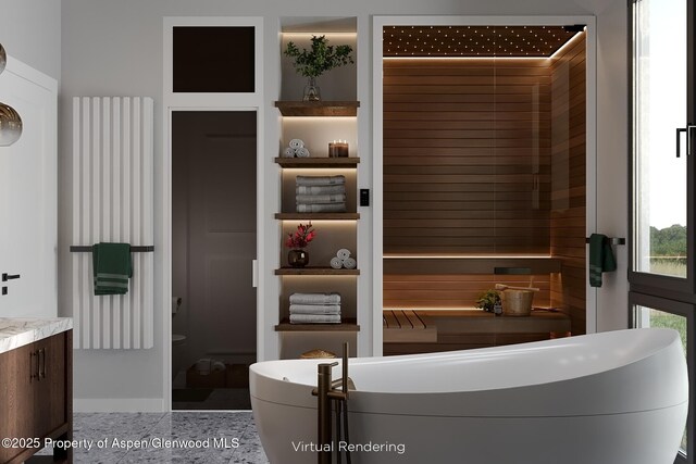 interior space featuring vanity and a bathtub