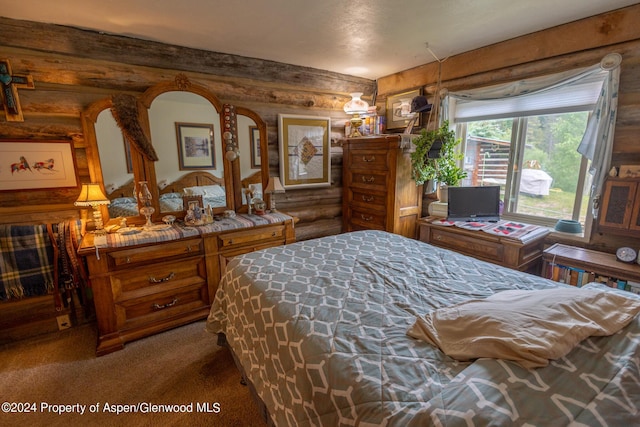 carpeted bedroom with rustic walls