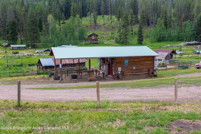 exterior space featuring an outbuilding and a rural view