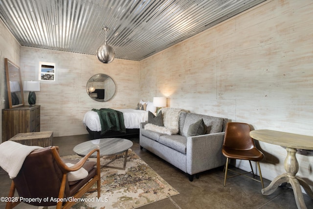 living area with concrete flooring