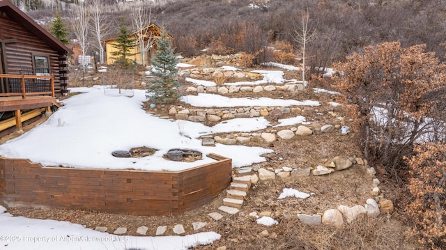 view of yard layered in snow