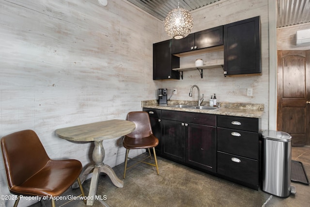 bar featuring finished concrete floors and a sink