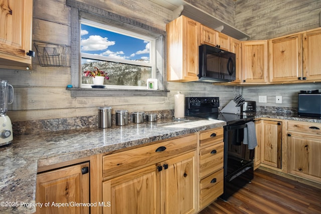 kitchen featuring stone countertops, tasteful backsplash, dark wood-style flooring, black appliances, and light brown cabinets