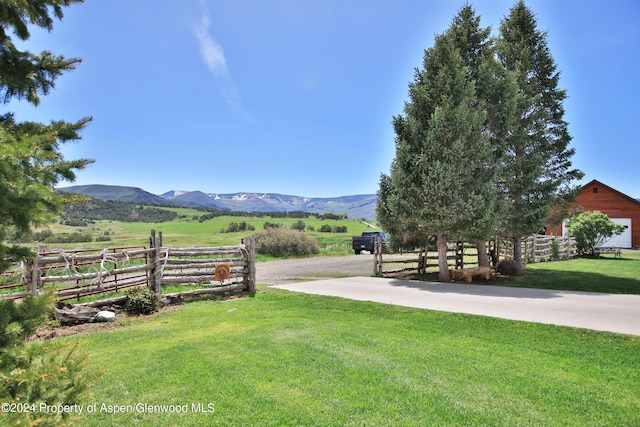 view of yard featuring a mountain view and a rural view