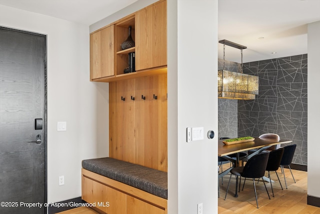 mudroom with light hardwood / wood-style floors