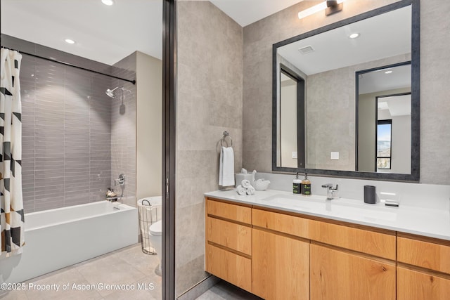 full bathroom featuring shower / bath combo, vanity, tile patterned floors, and toilet