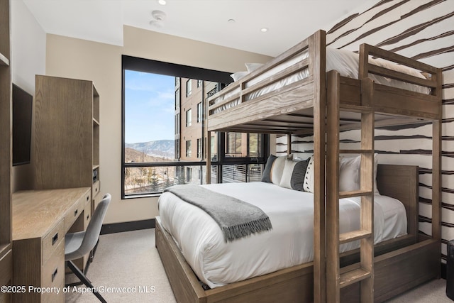 carpeted bedroom with a mountain view