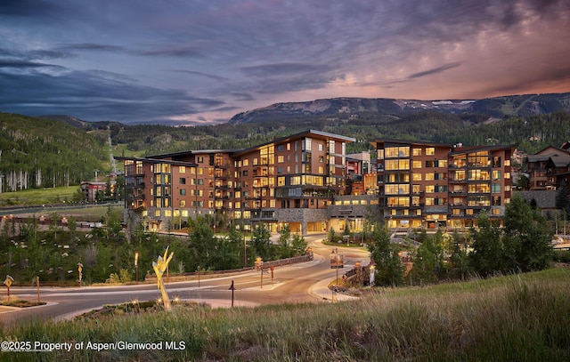 outdoor building at dusk featuring a mountain view