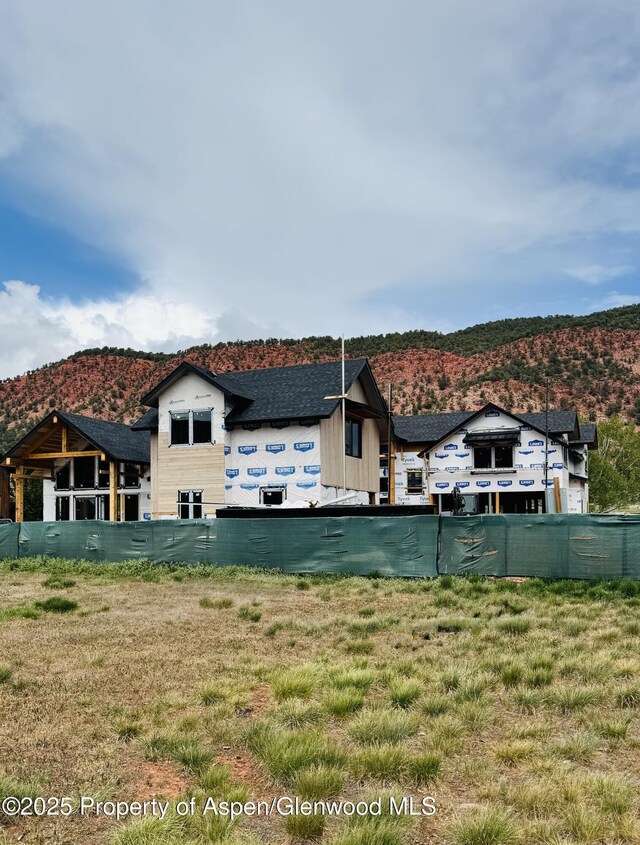 65 Upland Ln Unit 2, Carbondale, CO 81623 - back of property featuring a mountain view and a shingled roof