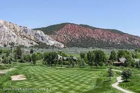 65 Upland Ln Unit 2, Carbondale, CO 81623 - view of home's community featuring a mountain view and a lawn