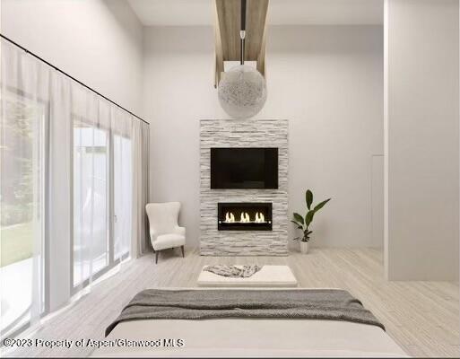 65 Upland Ln Unit 2, Carbondale, CO 81623 - living area featuring a tile fireplace and wood finished floors