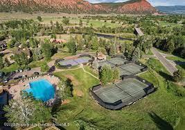 65 Upland Ln Unit 2, Carbondale, CO 81623 - aerial overview of property's location featuring a pool area and a mountain backdrop