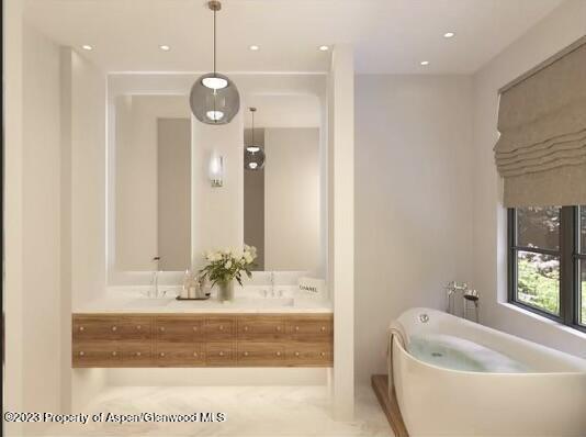 65 Upland Ln Unit 2, Carbondale, CO 81623 - full bath with a freestanding bath, double vanity, and recessed lighting