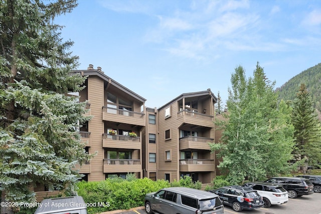 610 S W End St Unit H202, Aspen, CO 81611 - view of apartment building / complex featuring uncovered parking
