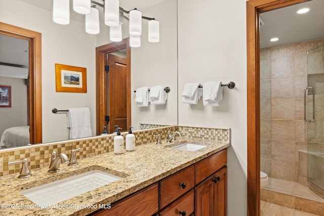 610 S W End St Unit H202, Aspen, CO 81611 - full bathroom featuring backsplash, ensuite bathroom, double vanity, a stall shower, and recessed lighting