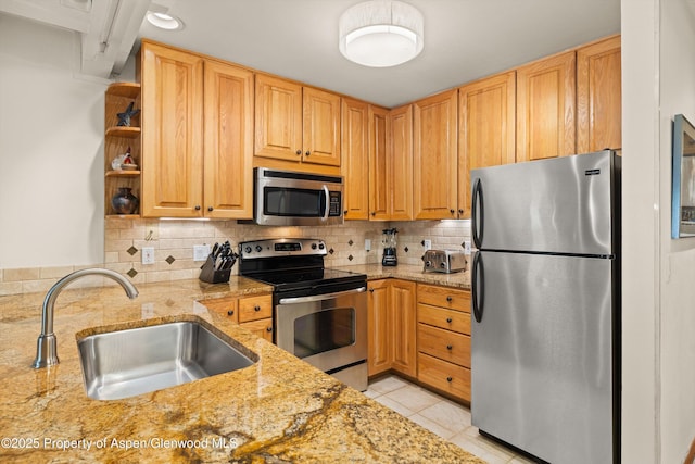 610 S W End St Unit H202, Aspen, CO 81611 - kitchen with appliances with stainless steel finishes, light stone countertops, backsplash, light tile patterned floors, and open shelves