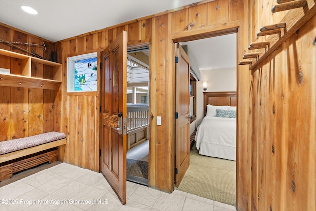 610 S W End St Unit H202, Aspen, CO 81611 - mudroom with wood walls and tile patterned flooring
