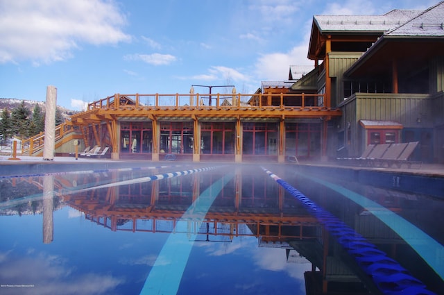 view of swimming pool with a water view