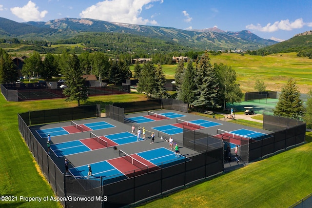 view of sport court with a mountain view