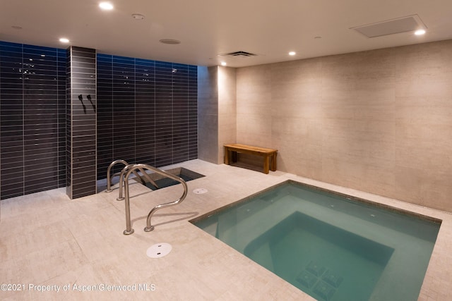 view of pool with an indoor in ground hot tub