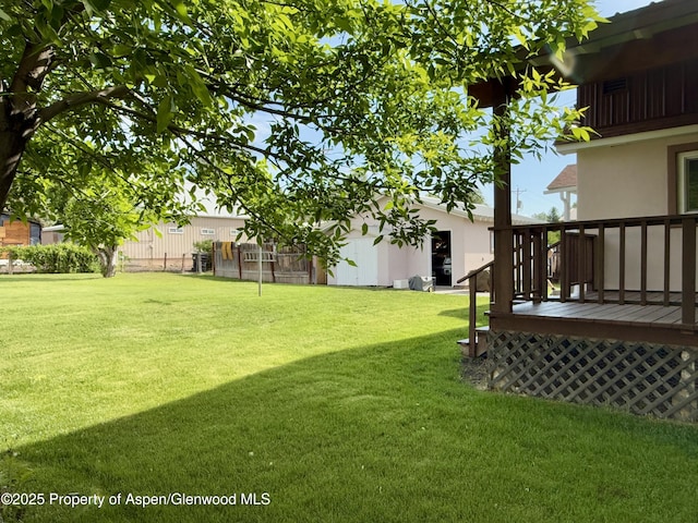 1217 Main St, Meeker, CO 81641 - view of yard with a wooden deck and an outbuilding