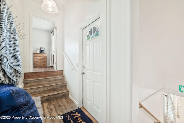 235 W 8th St, Craig, CO 81625 - entrance foyer featuring wood finished floors and stairway